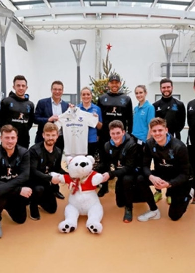 Sussex cricketers and Rob Andrew spread festive cheer during hospital visit